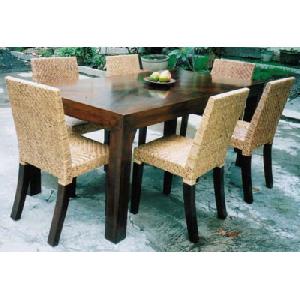 Solo Rattan Dining Chair In Set Combined With Dining Table Made From Mahogany Wood